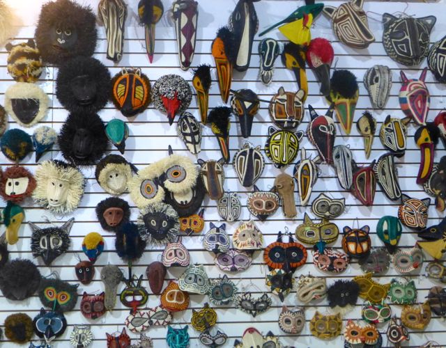 A wall of Embera masks at the craft market. 