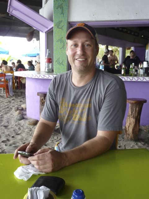 Jon at the beach cafe, anticipating the whole fried fish that he and Laura ordered.