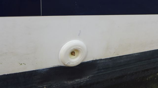 Step 3: The new electrode fitted into the hole. In theory, in the case of a lightning strike, the electricity should exit the boat from this electrode to water surface. 